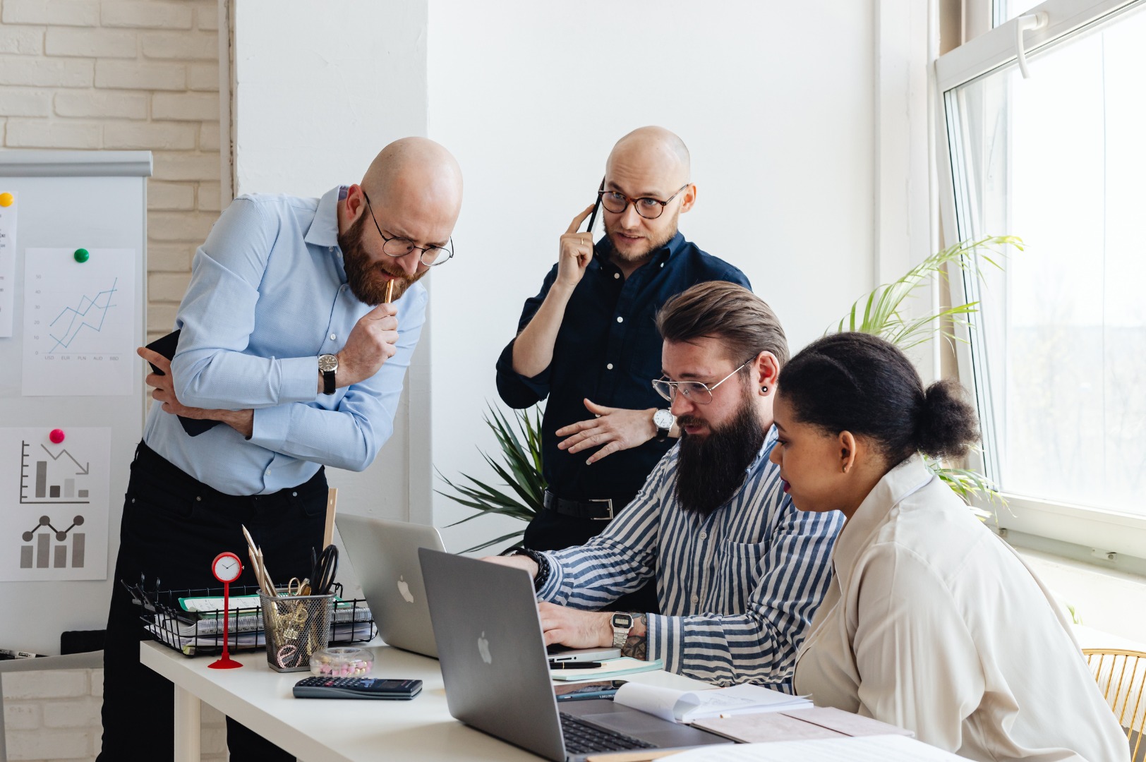 Management team reviewing performance reports